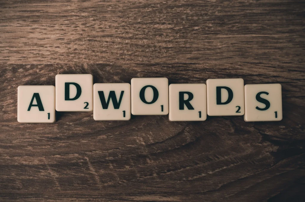 scrabble tiles spelling ADWORDS 